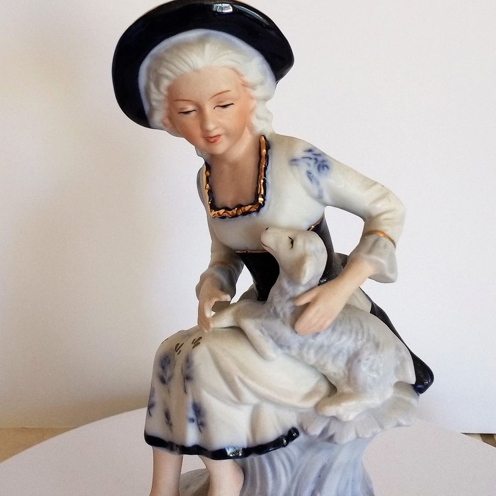 Vintage French porcelain figurine girl with sheep.